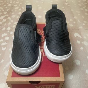 Toddler (walker) size 7.0 black slip on Vans with Velcro sides. Like new.